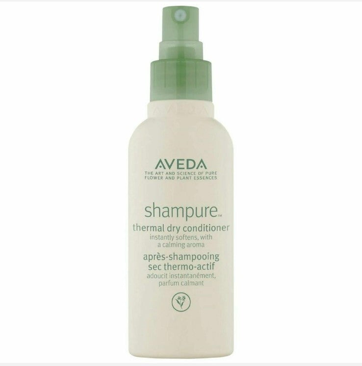 Aveda shampure thermal dry conditioner bottle on a white background. Aveda Shampure Thermal Dry Conditioner 3.4oz spray, lightweight leave-in treatment that protects hair from heat, detangles, and leaves strands soft and smooth.