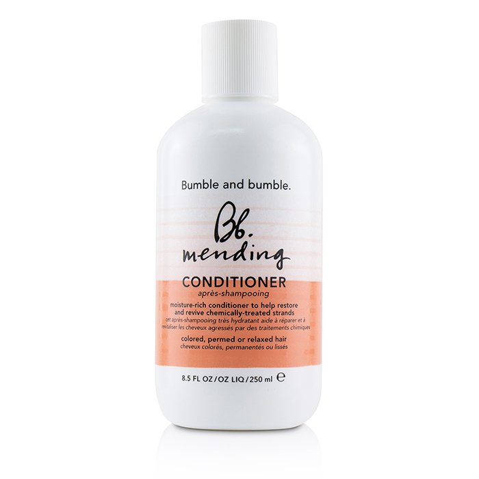 Bumble and bumble mending conditioner bottle on a white background. Bumble and Bumble Mending Conditioner 8.5oz bottle, repairing conditioner that strengthens, hydrates, and smooths damaged hair while improving softness, shine, and manageability.