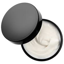 Black container of white cream on a white background. Bumble and Bumble While You Sleep Overnight Hair Repair Mask 6.4oz jar, intensive treatment that repairs, nourishes, and restores damaged hair while you sleep