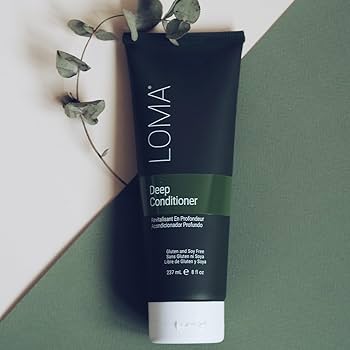 Loma Deep Conditioner tube on a green and white geometric background