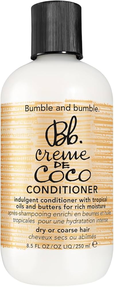 Bumble and bumble Creème de Coco Conditioner bottle on a white background. Bumble and Bumble Creme De Coco Conditioner 8.5oz bottle, nourishing conditioner that hydrates, softens, and enhances shine while leaving hair smooth, manageable, and healthy.