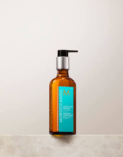 Moroccanoil bottle with pump on a light background