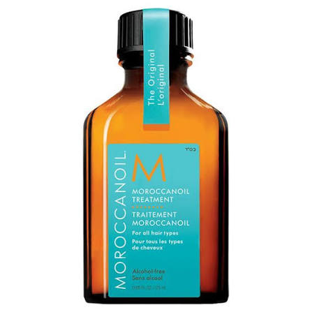 Moroccanoil treatment bottle with blue label on a white background