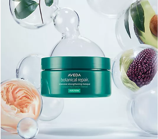 Aveda botanical repair product with decorative elements on a light background.Aveda Botanical Repair Intensive Strengthening Masque Rich 6.8oz jar, deeply nourishing treatment that repairs, strengthens, and restores damaged hair.