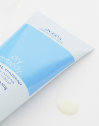 Aveda dry remedy hair product on a white background