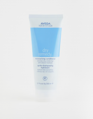 Aveda dry remedy product on a white background. Aveda Dry Remedy Moisturizing Conditioner 6.7oz bottle, rich conditioner that deeply hydrates dry hair, restores softness, smoothness, and improves manageability.