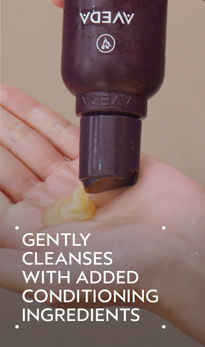 Aveda product being applied to a hand with text 'Gently cleanses with added conditioning ingredients'. Aveda Invati Advanced Exfoliating Shampoo Light 6.7oz bottle, gentle shampoo that exfoliates the scalp, cleanses hair, and promotes thicker, healthier-looking strands