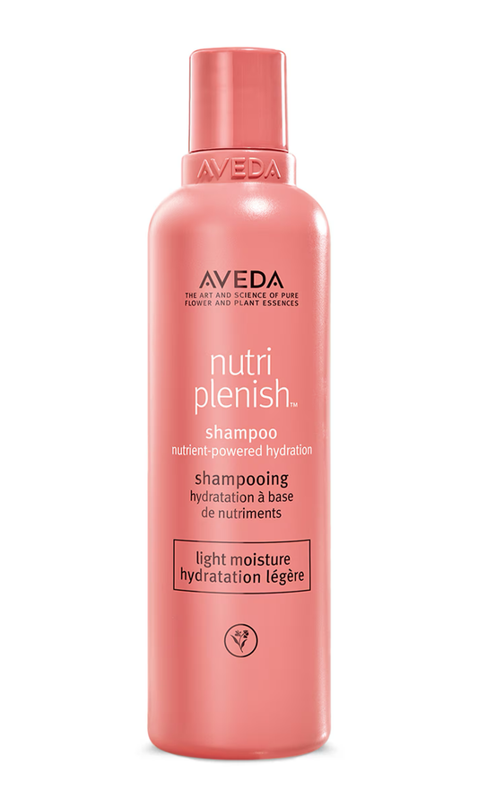 Aveda Nutriplenish shampoo bottle on a white background. Aveda Nutriplenish Light Moisture Shampoo 8.5oz bottle, lightweight shampoo that gently hydrates, nourishes hair, and enhances softness and shine without weighing it down.