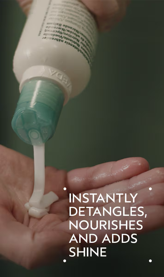 Hand applying a hair care product with text highlighting its benefits. Aveda Shampure Conditioner 8.5oz bottle, gentle conditioner that moisturizes, detangles, and leaves hair soft, smooth, and naturally healthy
