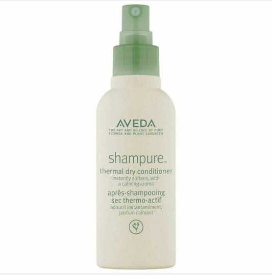 Aveda shampure thermal dry conditioner bottle on a white background. Aveda Shampure Thermal Dry Conditioner 3.4oz spray, lightweight leave-in treatment that protects hair from heat, detangles, and leaves strands soft and smooth.