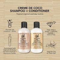 Two bottles of Crème de Coco shampoo and conditioner with product details on a white background.