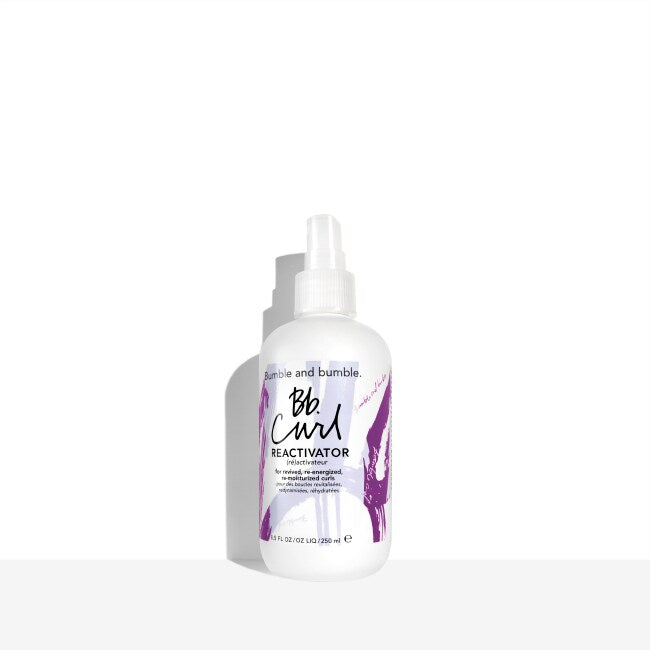 Bumble and bumble Curl Reactivator bottle on a white background. Bumble and Bumble Curl Reactivator 8.5oz bottle, lightweight spray that refreshes and reactivates curls, reduces frizz, and restores bounce, definition, and shine.