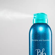 Blue bottle with teal cap labeled 'Bumble and Bumble' on a light gray background. Bumble and Bumble Does It All Light Hold Hairspray 10oz can, lightweight hairspray that provides gentle hold, natural movement, and frizz control.