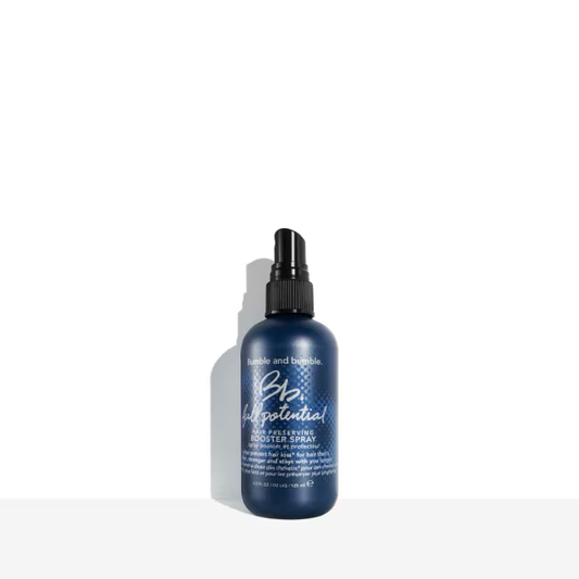 Blue spray bottle with text on a white background. Bumble and Bumble Full Potential Booster Spray 4.2oz bottle, lightweight spray that strengthens, nourishes, and boosts hair’s fullness, shine, and overall health.