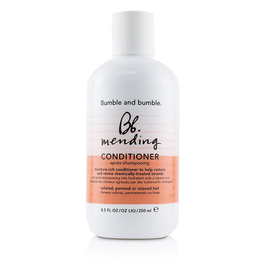 Bumble and bumble mending conditioner bottle on a white background. Bumble and Bumble Mending Conditioner 8.5oz bottle, repairing conditioner that strengthens, hydrates, and smooths damaged hair while improving softness, shine, and manageability.