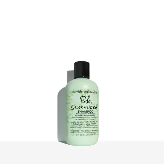 Bumble and bumble Seaweed shampoo bottle on a white background. Bumble and Bumble Seaweed Nourishing Shampoo 8.5oz bottle, gentle shampoo that hydrates, nourishes, and cleanses hair while enhancing softness, shine, and manageability.