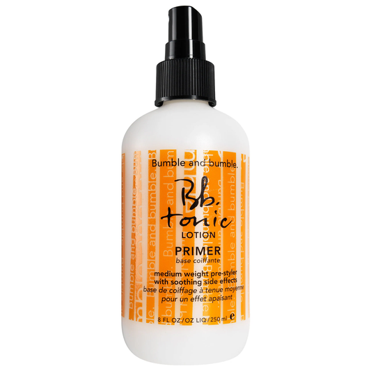Bumble and bumble Tonic Lotion Primer bottle on a white background. Bumble and Bumble Tonic Primer Lotion 8.5oz bottle, lightweight lotion that preps hair for styling, adds moisture, improves manageability, and enhances overall hair health.