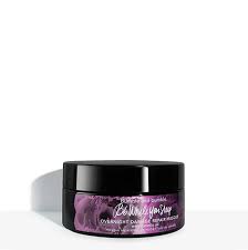 Black jar with purple label on a white background. Bumble and Bumble While You Sleep Overnight Hair Repair Mask 6.4oz jar, intensive treatment that repairs, nourishes, and restores damaged hair while you sleep