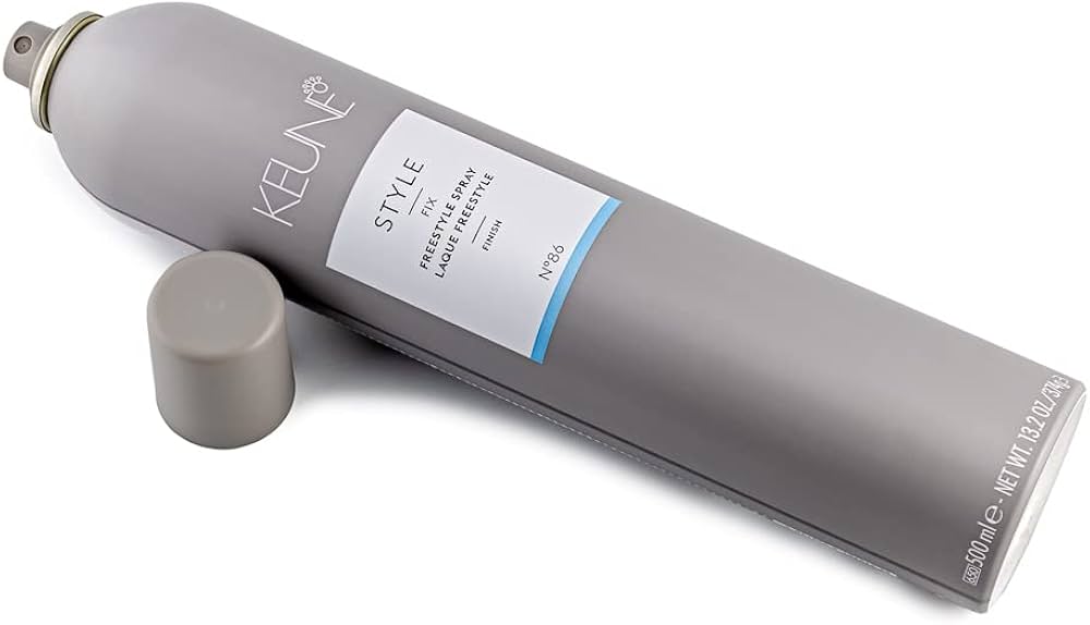 Keune hair product tube on a white background. Keune Style Fix Freestyle Spray 9.1oz can, versatile hairspray that provides flexible hold, long-lasting style, and natural movement without stiffness.
