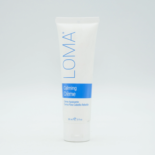 Loma Calming Creme container on a light gray background. Loma Calming Creme 3oz jar, soothing hair treatment that calms the scalp, nourishes strands, and restores softness, moisture, and manageability.