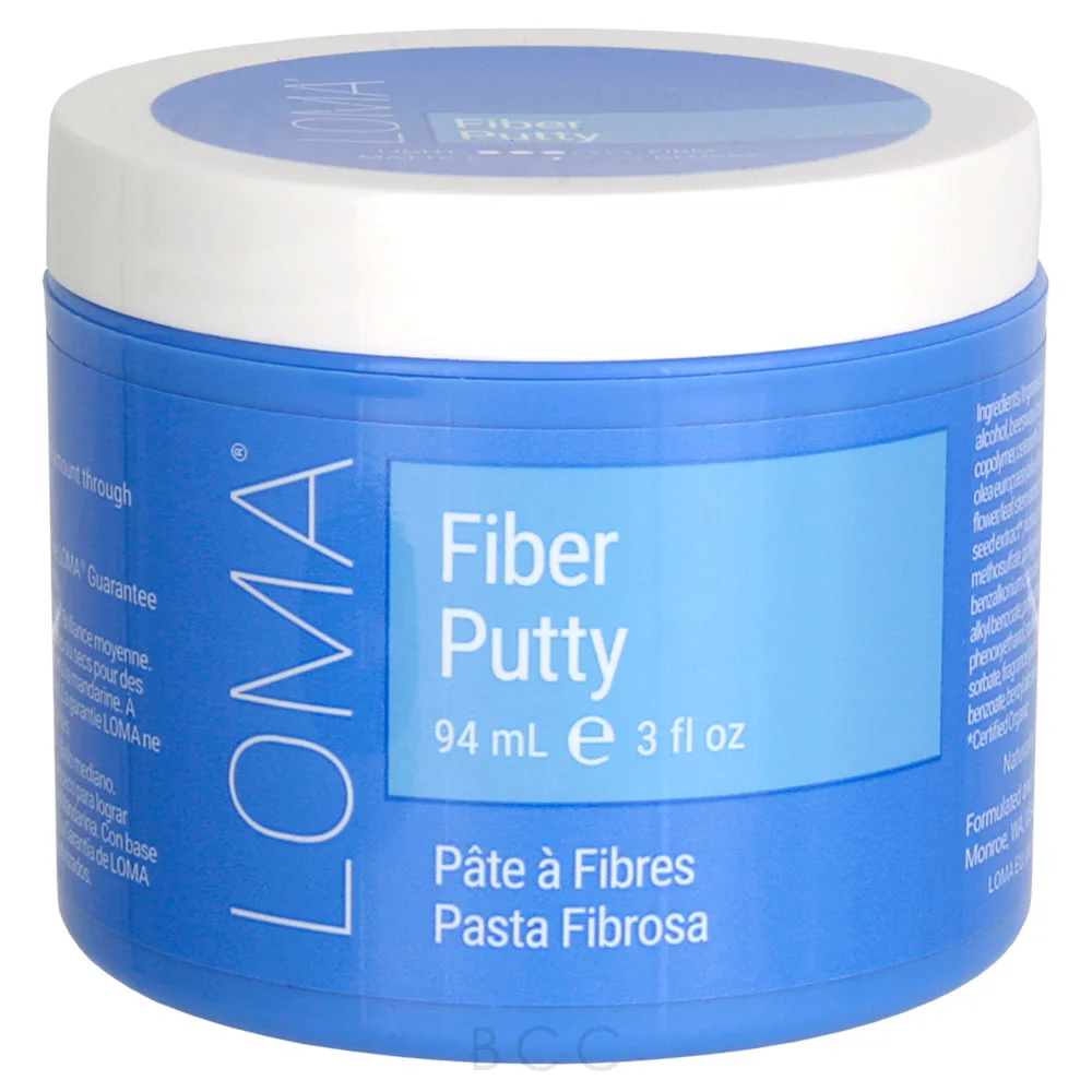 Blue jar of LOMA Fiber Putty with white lid on a white background. Loma Fiber Putty 3oz jar, styling putty that provides flexible hold, texture, and definition while adding volume and control without stiffness or residue