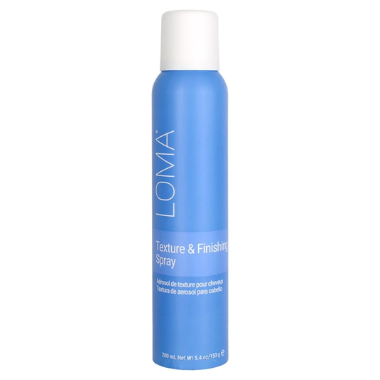 Blue spray bottle with white cap labeled 'LOMA' on a white background. Loma Texture & Finishing Spray 5.4oz bottle, lightweight spray that adds texture, volume, and hold while finishing styles with natural movement and shine.