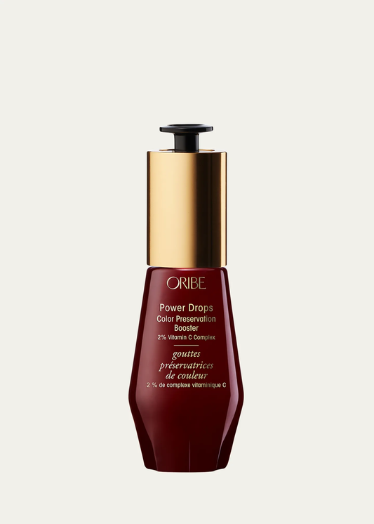 Oribe hair product bottle on a white background.Oribe Color Power Drops Color Preservation Booster 1oz, 2% Vitamin C Complex that protects hair color, boosts vibrancy, and prolongs color-treated hair’s lifespan.