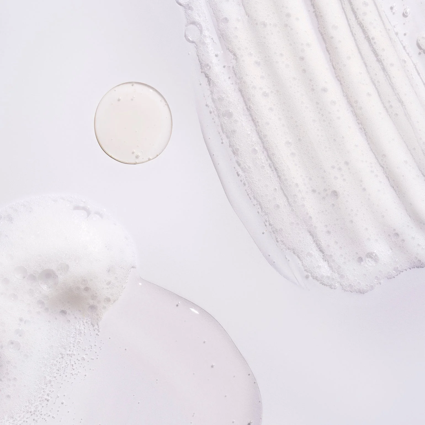 Close-up of a Oribe Serene Scalp Oil Control Shampoo, gentle cleansing shampoo that removes excess oil, soothes the scalp, and leaves hair refreshed, clean, and healthy.