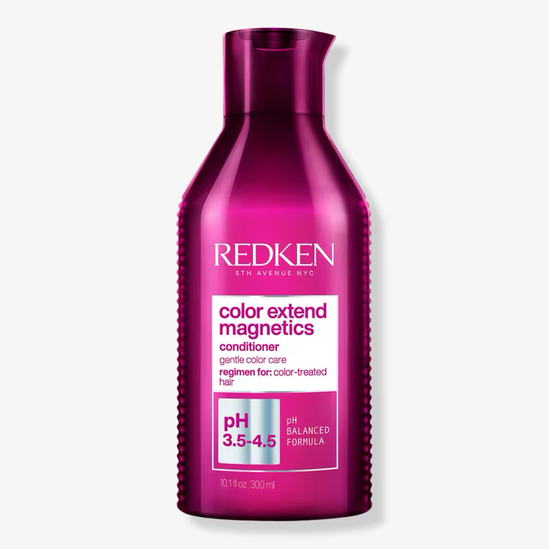 Redken Color Extend Magnetics conditioner bottle on a white background. Redken Color Extend Magnetics Conditioner 10oz bottle for color-treated hair.